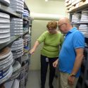 Mary Huelsbeck, assistant director of the Wisconsin Center for Film and Theater Research, and director Jeff Smith, in the Wisconsin Historical Society vault.  Old movies, TV classics, and a series of Soviet films share the space on both 35 millimeter reels and the 16 millimeter reels seen here. 
