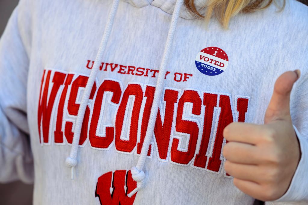 Photo: Wisconsin sweatshirt with I voted sticker on it