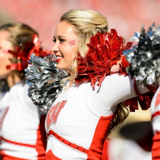 Members of the UW Spirit Squad cheer on the crowd during the UW Homecoming football games versus Maryland inside Camp Randall Stadium at the University of Wisconsin-Madison on Oct. 21, 2017. The Badgers won the game 38-13. (Photo by Bryce Richter / UW-Madison)