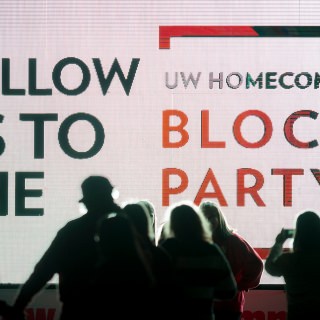 UW alumni and members of the Madison community make their way to the UW Homecoming Block Party at Alumni Park at the University of Wisconsin-Madison on Oct. 20, 2017. The event followed the Homecoming Parade that took place earlier in the evening. (Photo by Bryce Richter / UW-Madison)