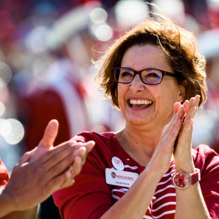 Sarah Schutt, chief alumni officer and executive director of Wisconsin Alumni Association, join members of the homecoming committee during halftime of the UW Homecoming football game against the Maryland Terrapins at Camp Randall Stadium at the University of Wisconsin-Madison on Oct. 21, 2017. The Wisconsin Badgers won the game, 38-13. (Photo by Jeff Miller / UW-Madison)