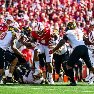 Wisconsin wide receiver A.J. Taylor (#4) runs the ball for yardage as the Wisconsin Badgers take on the Maryland Terrapins during a UW Homecoming football game at Camp Randall Stadium at the University of Wisconsin-Madison on Oct. 21, 2017. Wisconsin won the game, 38-13. (Photo by Jeff Miller / UW-Madison)