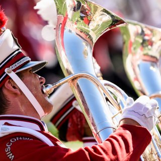 Sweat pours for a UW Marching Band member performing at halftime as the Wisconsin Badgers take on the Maryland Terrapins during a UW Homecoming football game at Camp Randall Stadium at the University of Wisconsin-Madison on Oct. 21, 2017. Wisconsin won the game, 38-13. (Photo by Jeff Miller / UW-Madison)