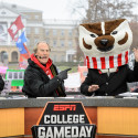 Photo of The day's celebrity guest, actor Craig T. Nelson, closing the broadcast with Corso clad as Bucky Badger.
