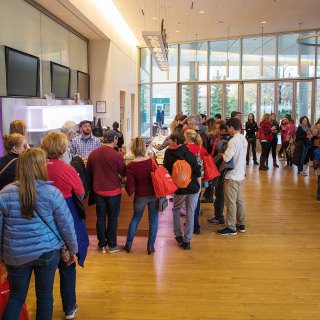 Event attendees line up to participate the Life of Cheese: A Tasting and Science of Cheese event at Discovery Building's Steenbock's on Orchard Restaurant in Madison, WI. Saturday, Nov. 4, 2017. This event was about an exploration and tasting of cheese as it ages, from cheese curds to Parmesan-Reggiano. This event is put on by the Wisconsin Science Festival and Steenbock’s on Orchard exclusively for Family Weekend, and it was sold-out. (Photo by Hyunsoo Léo Kim | University Communications)