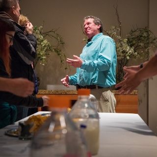 A farmer, John Dougherty, center, brings out the passion of his cheese making to the participants of the Life of Cheese: A Tasting and Science of Cheese event at Discovery Building's Steenbock's on Orchard Restaurant in Madison, WI. Saturday, Nov. 4, 2017. This event was about an exploration and tasting of cheese as it ages, from cheese curds to Parmesan-Reggiano. This event is put on by the Wisconsin Science Festival and Steenbock’s on Orchard exclusively for Family Weekend, and it was sold-out. (Photo by Hyunsoo Léo Kim | University Communications)