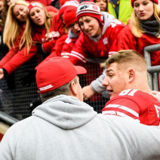 Wisconsin Head Coach Paul Chryst, left, and tight end Troy Fumagalli (81), a graduating senior, exit the field following Wisconsin's 24-10 football victory over the Michigan Wolverines at Camp Randall Stadium at the University of Wisconsin-Madison on Nov. 18, 2017. (Photo by Jeff Miller / UW-Madison)