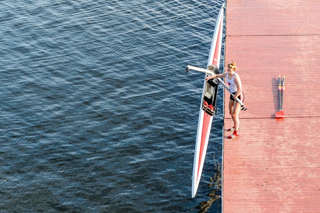 Photo: Maddie Wanamaker lifting a boat into or out of the water