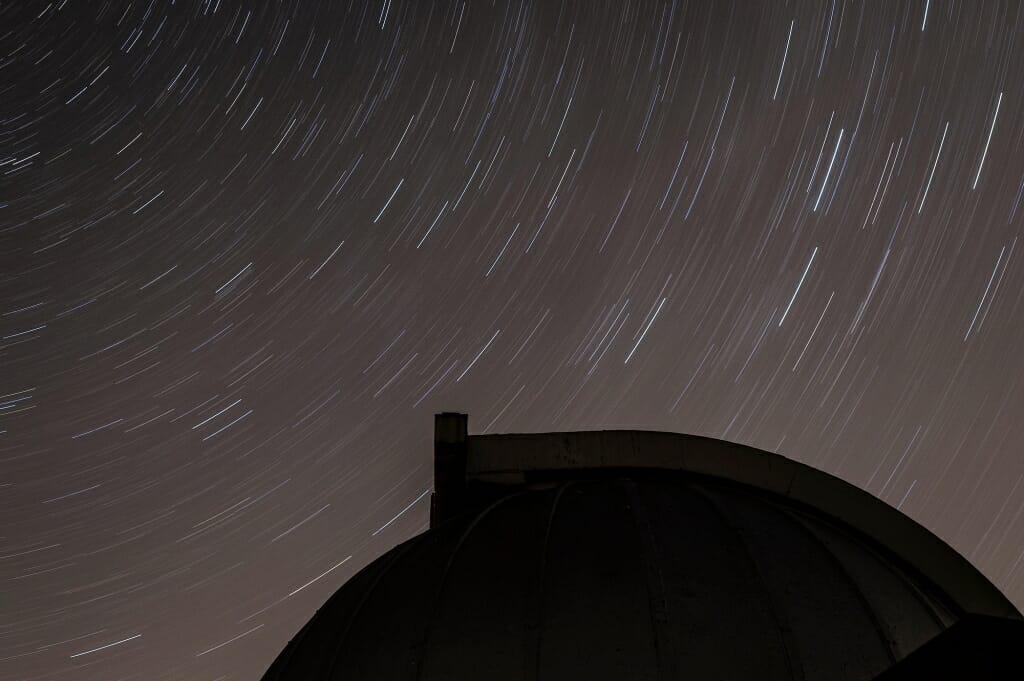 Photo: Stars seeming to form trails above observatory