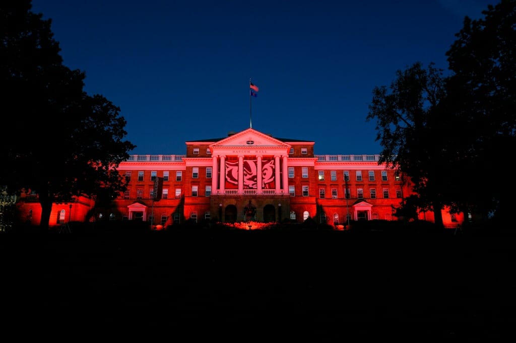 Photo: Bascom Hall illuminated by red lights