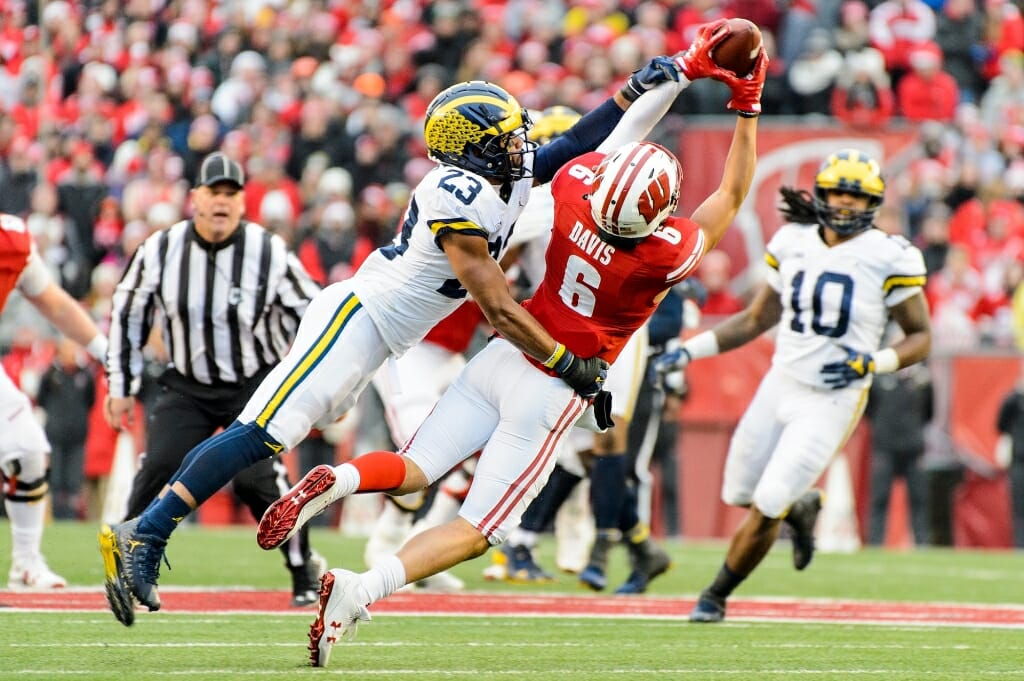 Photo: Wisconsin player catching pass over Michigan defender