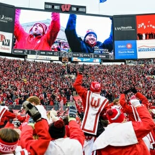 Members of the UW Marching Band and Wisconsin Badger fans dance to the song, "Jump Around," at the end of the third quarter as Wisconsin plays a football game against the Michigan Wolverines at Camp Randall Stadium at the University of Wisconsin-Madison on Nov. 18, 2017. Wisconsin won the game, 24-10. (Photo by Jeff Miller / UW-Madison)