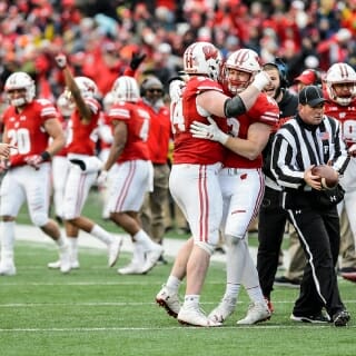 Wisconsin Players Matt Henningsen (94) and Ryan Connelly (43) celebrate a defensive play as the Wisconsin Badgers play a football game against the Michigan Wolverines at Camp Randall Stadium at the University of Wisconsin-Madison on Nov. 18, 2017. Wisconsin won the game, 24-10. (Photo by Jeff Miller / UW-Madison)