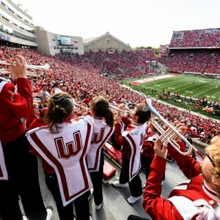 Members of the UW Marching Band play for fans in the stands as the Wisconsin Badgers take on the Maryland Terrapins during a UW Homecoming football game at Camp Randall Stadium at the University of Wisconsin-Madison on Oct. 21, 2017. Wisconsin won the game, 38-13. (Photo by Jeff Miller / UW-Madison)