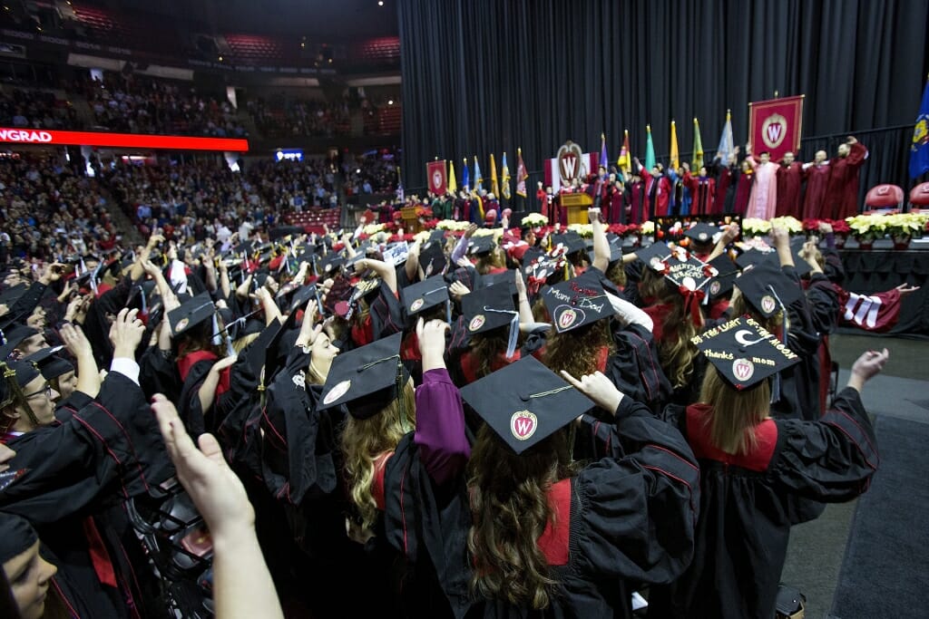 Photo of graduates singing "Varsity" at the ceremony's end.