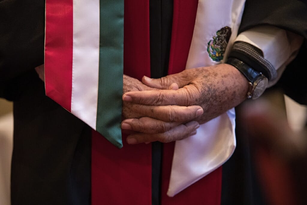 Photo of Barraza wearing a graduation stole representing his native country, Mexico.