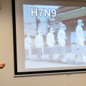 Yoshihiro Kawaoka, professor of pathobiological sciences in the School of Veterinary Medicine, gives a slide presentation to a group of media representatives touring the Influenza Research Institute (IRI) at the University of Wisconsin-Madison on Feb. 28, 2017. The high-security research facility was closed down for annual decontamination, cleaning and maintenance. (Photo by Jeff Miller/UW-Madison)