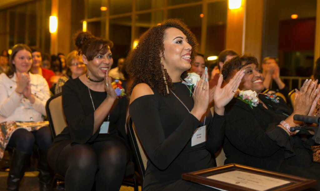 Honorees Posse Scholar Brianna Young, the first undergraduate to become an honoree, and Barbara Nichols, right, the and advocate of diversity in nursing, applaud their peers. 
