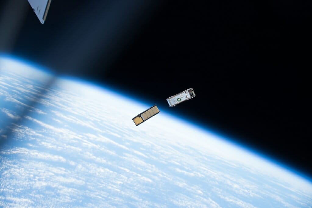 Photo: CubeSats in orbit over Earth