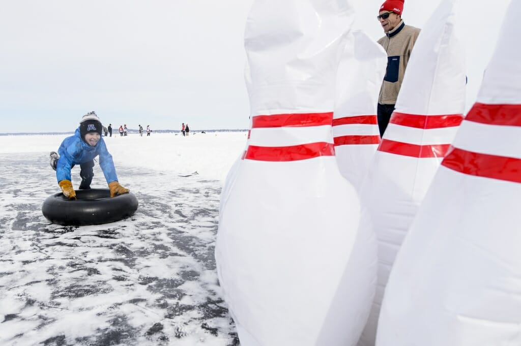 Photo of Erik Larson taking part in human bowling, one of the more unconventional winter sports featured.