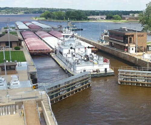 Photo: Barge floating through open locks