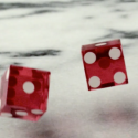 Still image from video: Pair of red dice in motion
