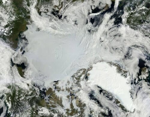 Photo: Satellite view of Arctic sea ice and Greenland ice sheet