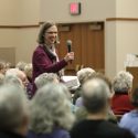 UW Arboretum director Karen Oberhauser passes the microphone to her mother, Suzanne Oberhauser, during audience questions for the first lecture in the 50th year of winter enrichment talks. 