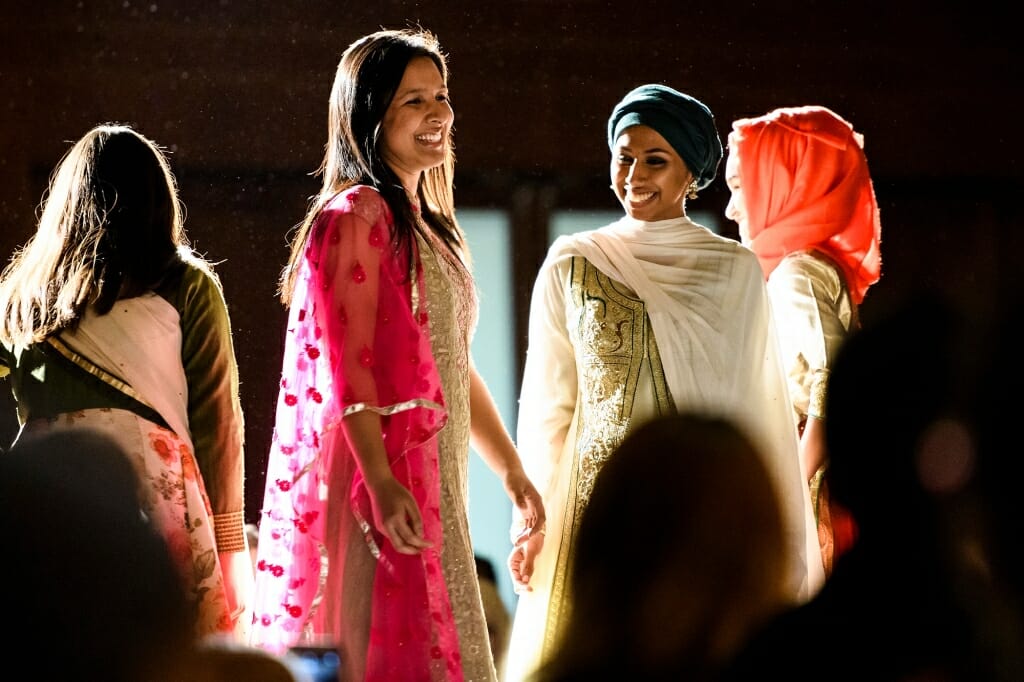 Students model traditional Bangladeshi clothing. Styles include a Salwar Kameez, a traditional South Asian outfit that can be worn at formal events or everyday occasions.