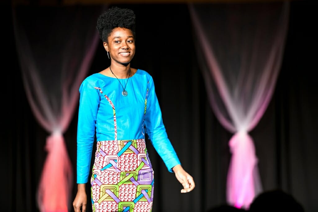Student Yaa Bema Tutu wears a Holland print straight dress. Holland print is an expensive cloth used in Ghana to make contemporary clothes. This dress was created from six yards of fabric.