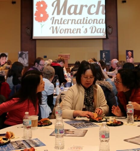 Photo: Women sitting around a banquet table