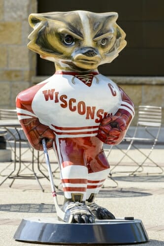 Photo of Bucky Badger as a hockey player in Wisconsin uniform.