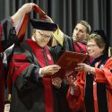 Photo of Jerome Chazen, founding partner and chairman of Liz Claiborne Inc., receiving an honorary degree from Chancellor Rebecca Blank.