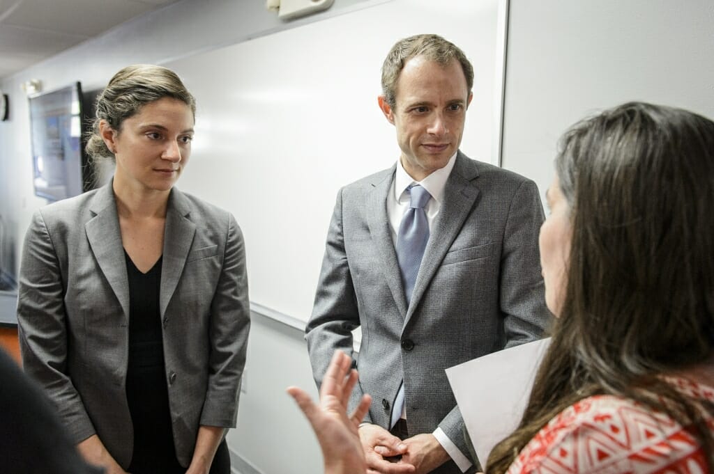 Photo of Cassie Crockett (left) and Eric Braverman (right), of Schmidt Futures, speaking to audience members following a kickoff event for the Alliance for the American Dream, a new community-university collaboration.