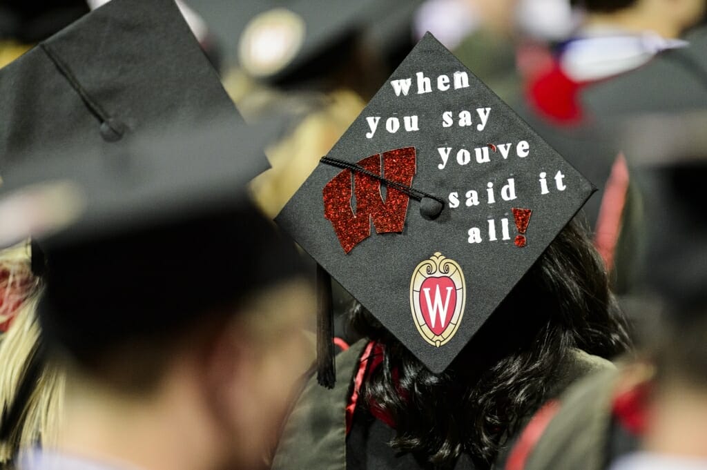Photo of a mortarboard reading "When you say W, you've said it all."