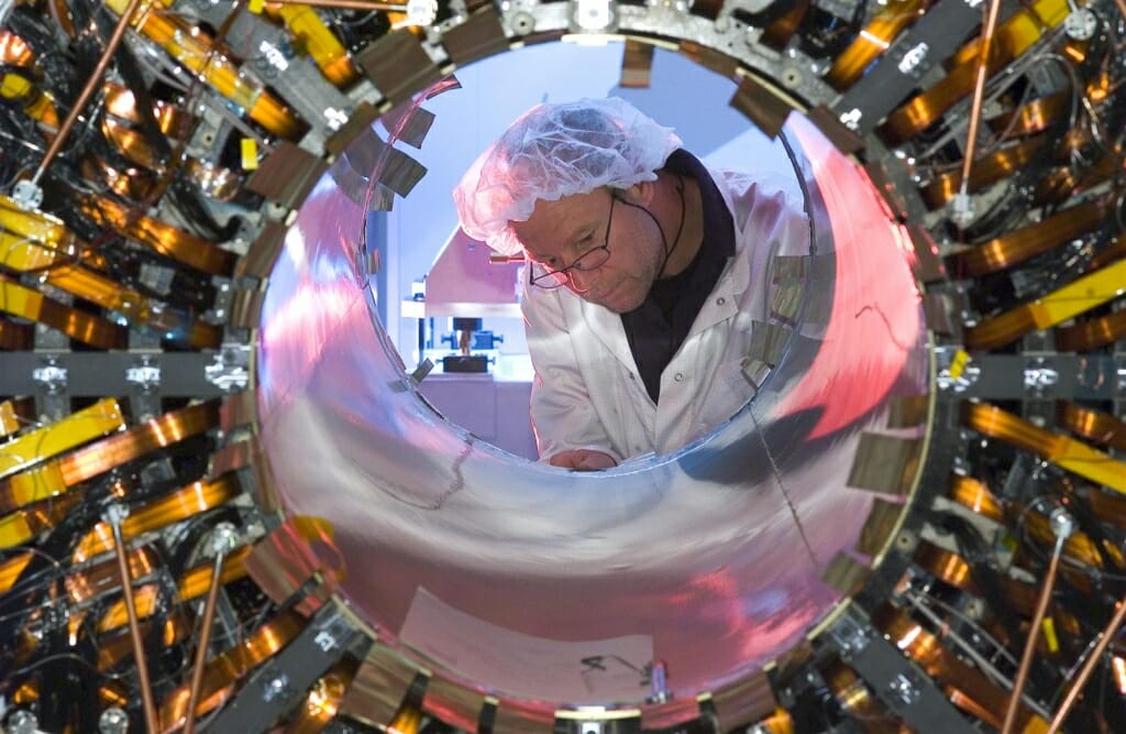 Photo: Worker seen through a semiconductor barrell