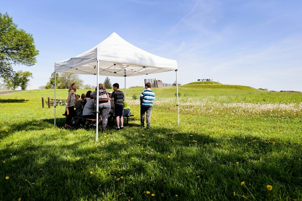 Photo: Students under tent top