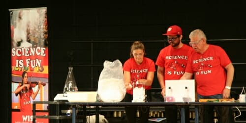 Photo: Three presenters looking at packing peanuts