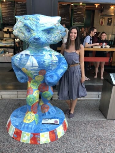 Artist Nicole Rosenbaum stands next to the Bucky she designed, Terrace Bucky, outside of Collectivo Coffee.