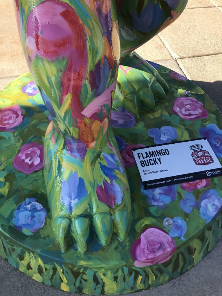 A close-up look of Flamingo Bucky's foot, which is covered in painted flowers. 