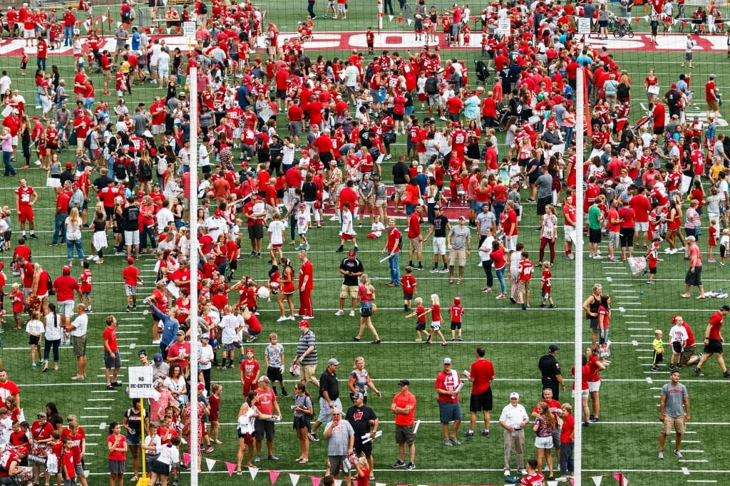 Badger fans dot the field during Football Family Fun Day.