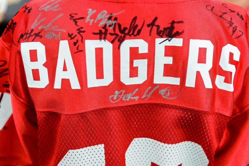 Player signatures adorn a young fan's jersey.