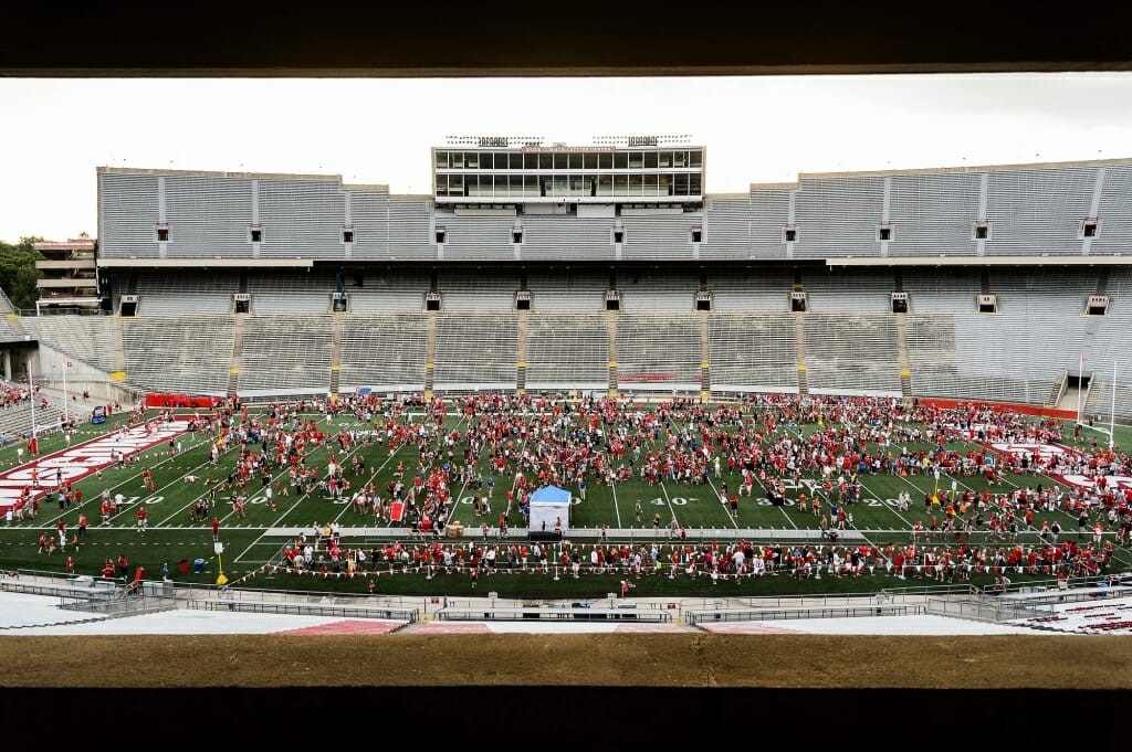 Badger fans dot the field during Football Family Fun Day at Camp Randall Stadium on Aug. 1.