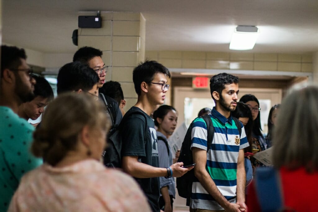 The international students hear how Babcock Hall ice cream is made.