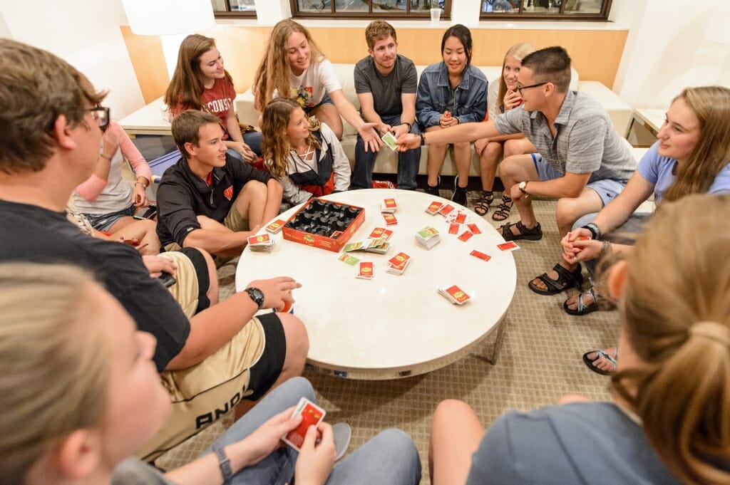 Students play a card game.