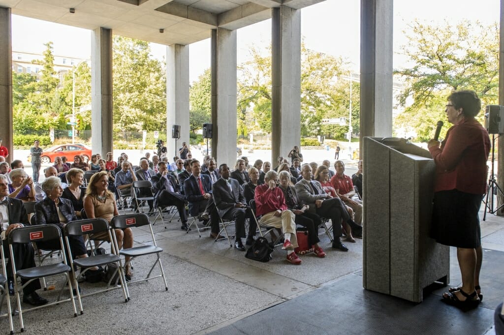 A crowd listens to Rebecca Blank.