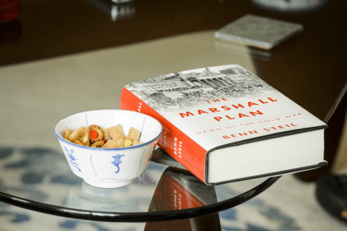 Photo: Book on table next to a small bowl of Chex Mix