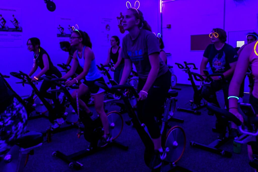 A glow-in-the-dark group spin class at the Natatorium.