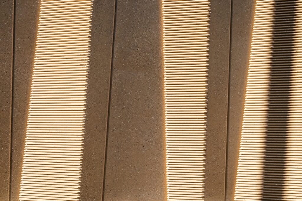 The exterior-wall panels are designed to look differently at different times of the day, depending on the shadows cast.