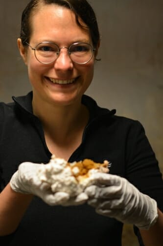 Photo of Jaqueline Hess holding mushrooms.
